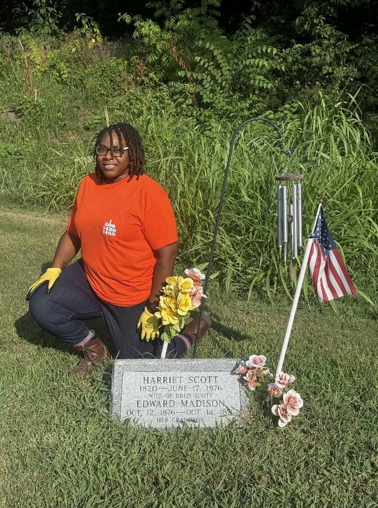 Shondra Adams tending the grave of Harriet Scott